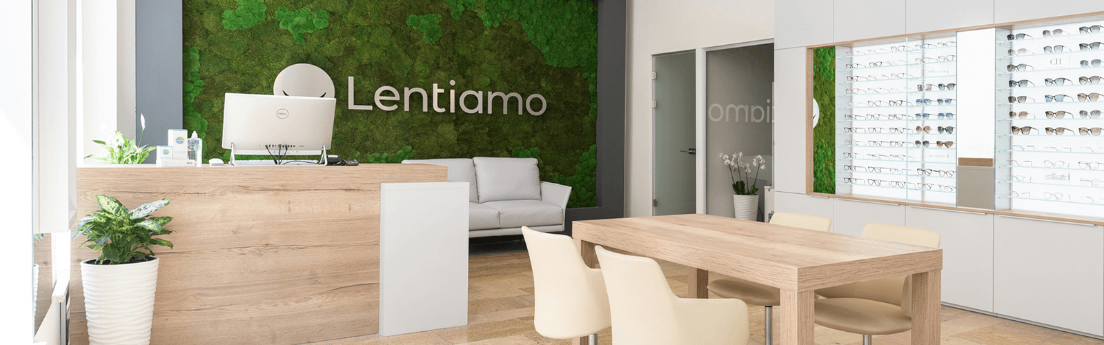 modern optical store with glasses display and green moss wall